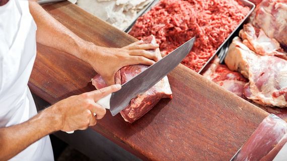One of our butchers cutting meat 